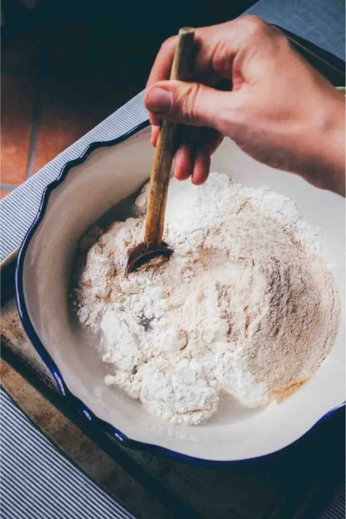 mixing bowl, whisk together the flour